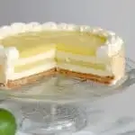 a Lime Layered Cheesecake on a cake stand