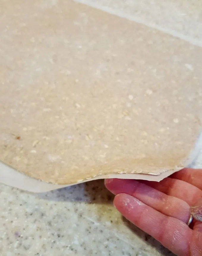 a thinly rolled sheet of oatmeal dough