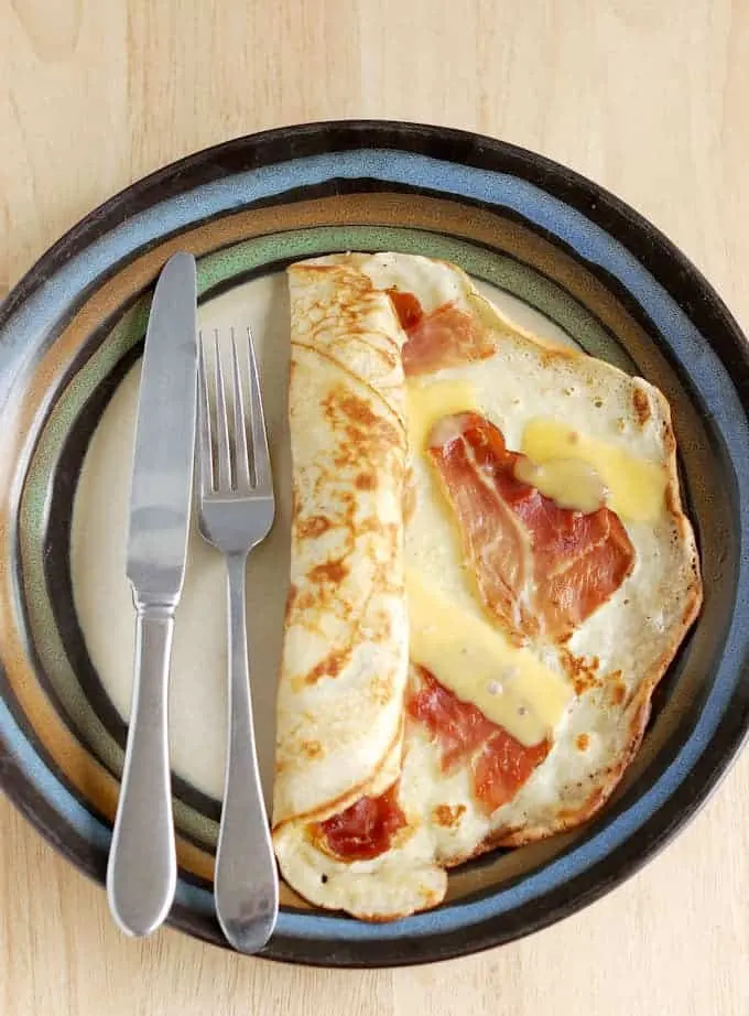 a Savory Dutch Pancake, pannekoeken, with speck and gouda.