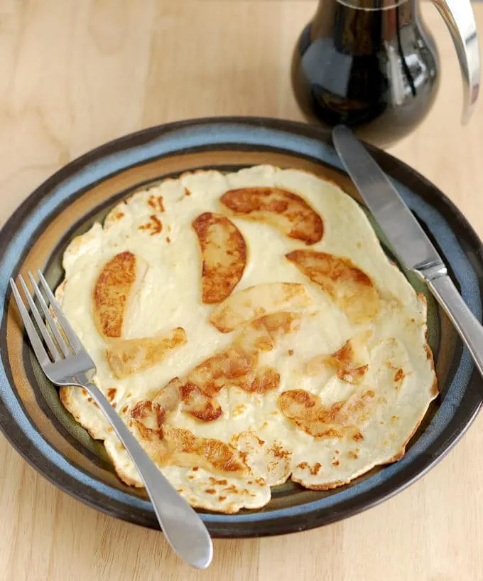 a Sweet Dutch Pancake with sauteed cinnamon apples on top.