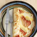 a pinterest image of a savory dutch pancake, pannekoeken