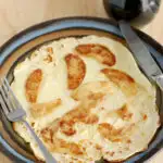 a pinterest image for an apple dutch pancake, pannekoeken