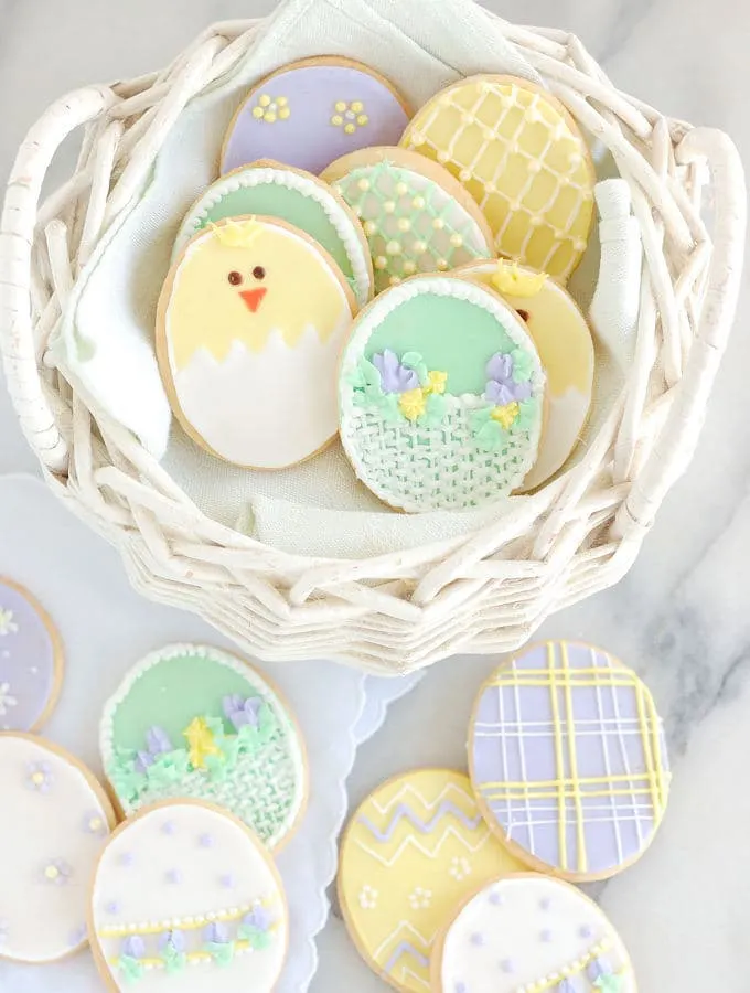 a basket of decorated sugar cookie for easter