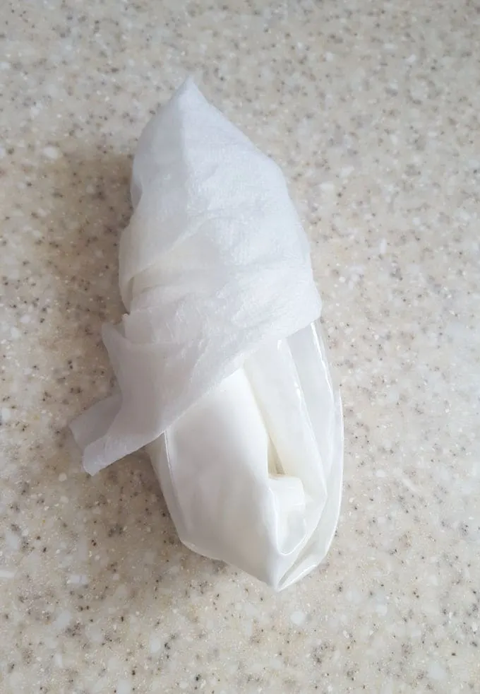 a bag pf  royal icing wrapped in a damp towel
