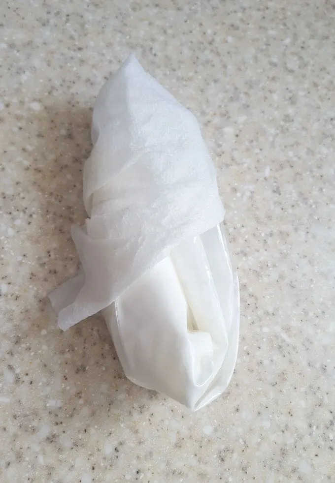 a bag pf royal icing wrapped in a damp towel