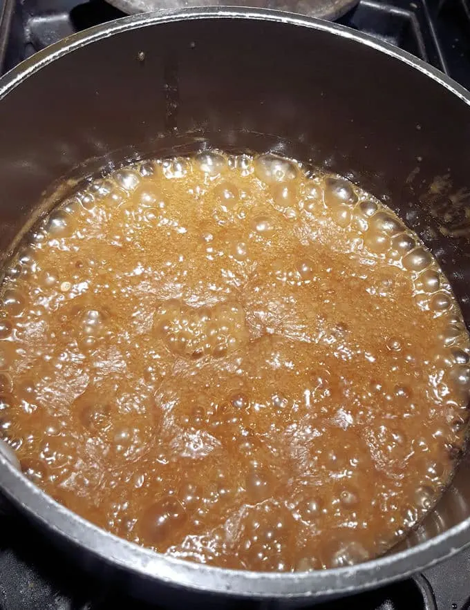 a pot full of bubbling butterscotch