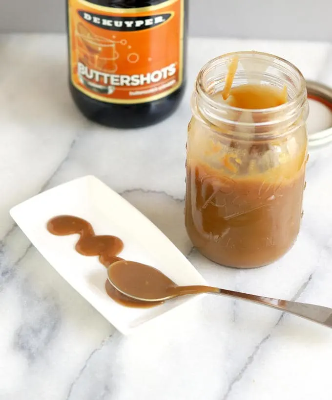 butterscotch sauce in a jar and on a plate