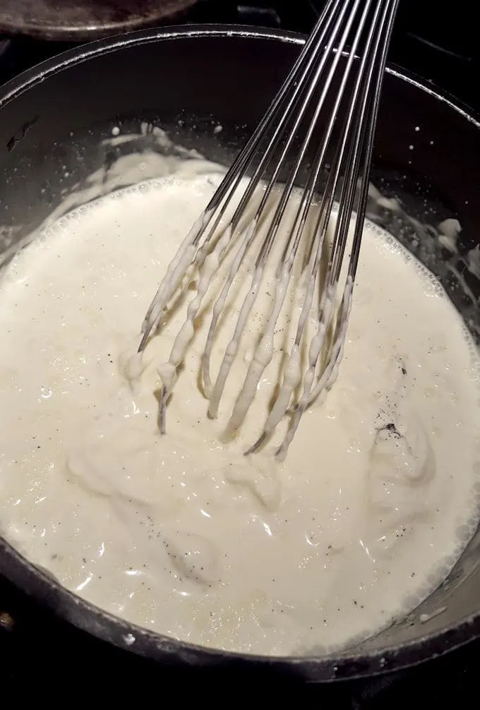 adding creme fraiche to custard to make ice cream