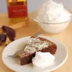 a slice of flourless mexican hot chocolate cake with tequila whipped cream