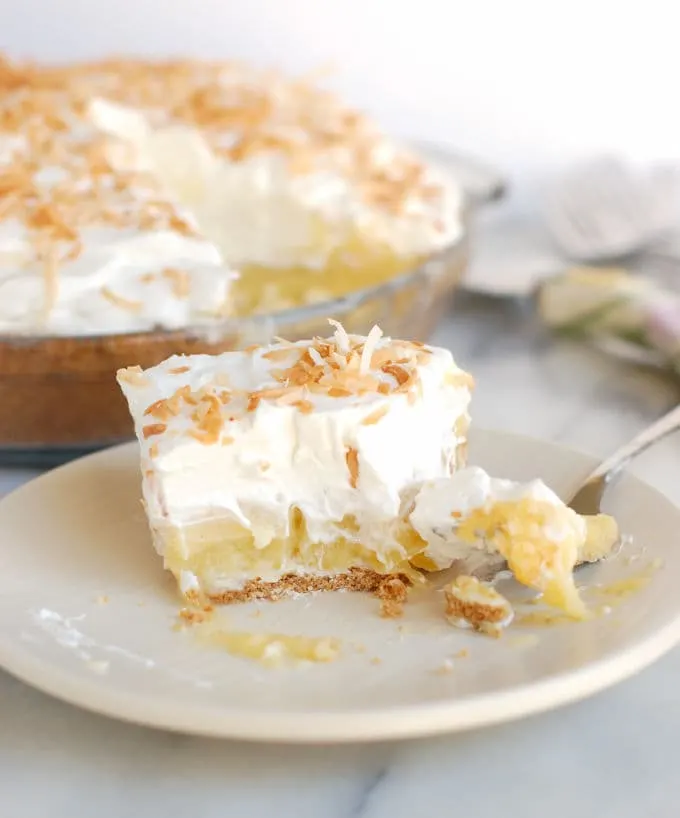 a partially eaten slice of pina colada pie 