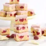 White chocolate brownies made with raspberries and topped with whipped raspberry ganache.