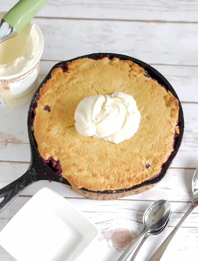 a blueberry cornbread cobbler in a skillet