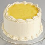 a pinterest image for lemon mousse cake with text overlay.
