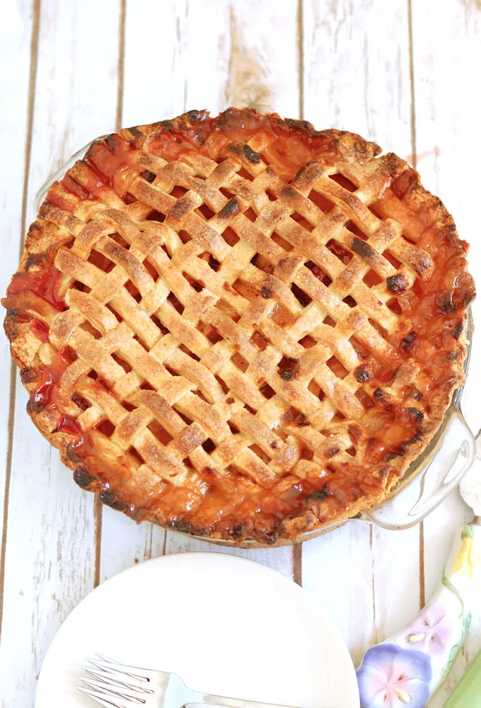 an apricot raspberry pie with lattice crust