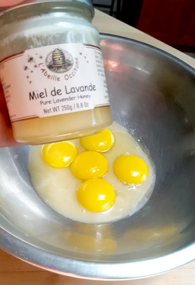 lavender honey and egg yolks in a bowl