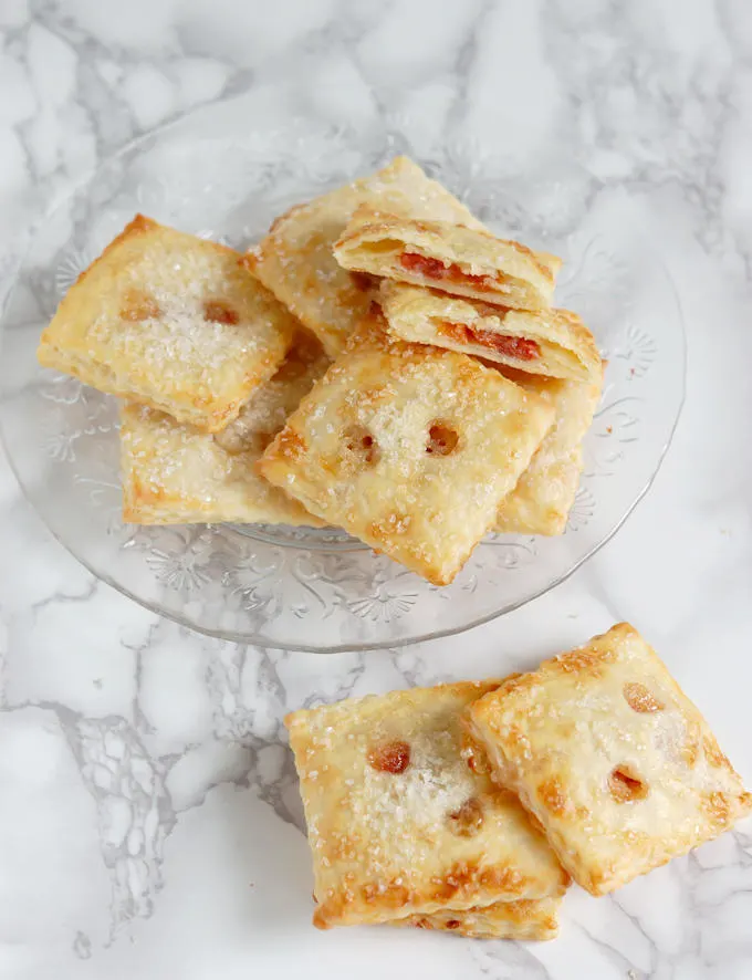 a plate of cherry almond hand pies