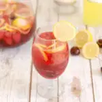 a glass of pink lemonade sangria