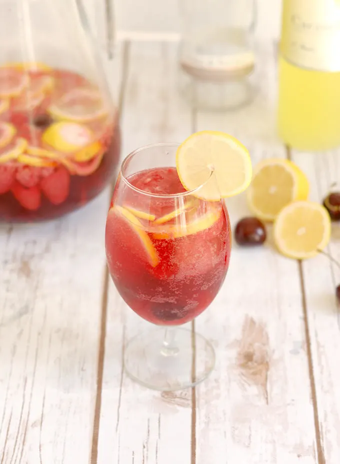 a glass of pink lemonade sangria