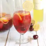 a glass of pink lemonade sangria