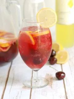 a glass of pink lemonade sangria