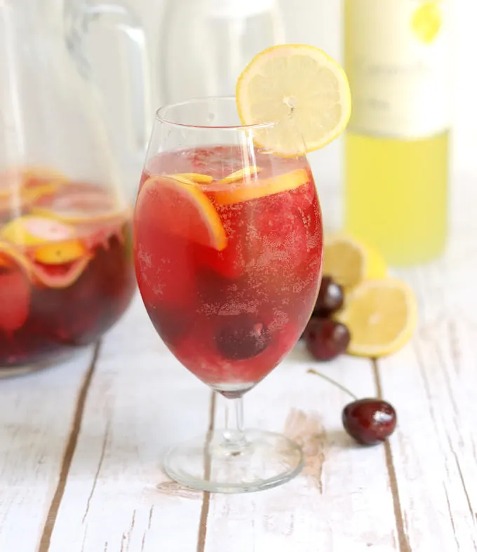 a glass of pink lemonade sangria 