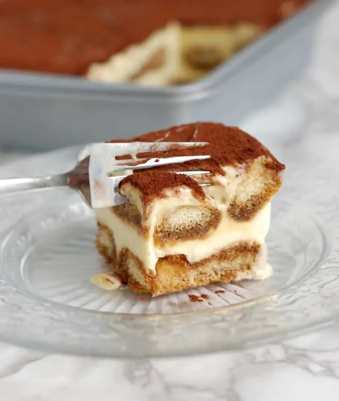 a fork digging into a frozen tiramisu ice cream cake