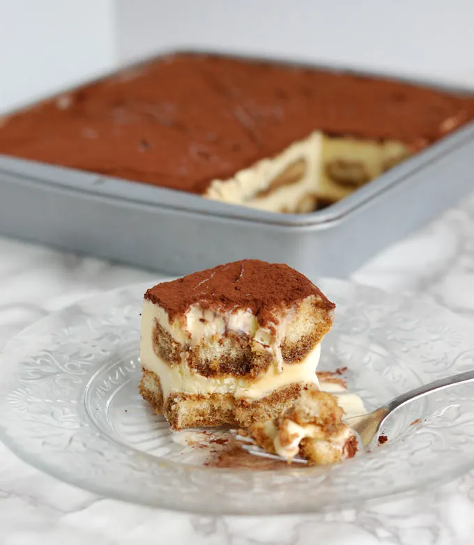 a half eaten portion of frozen tiramisu ice cream cake