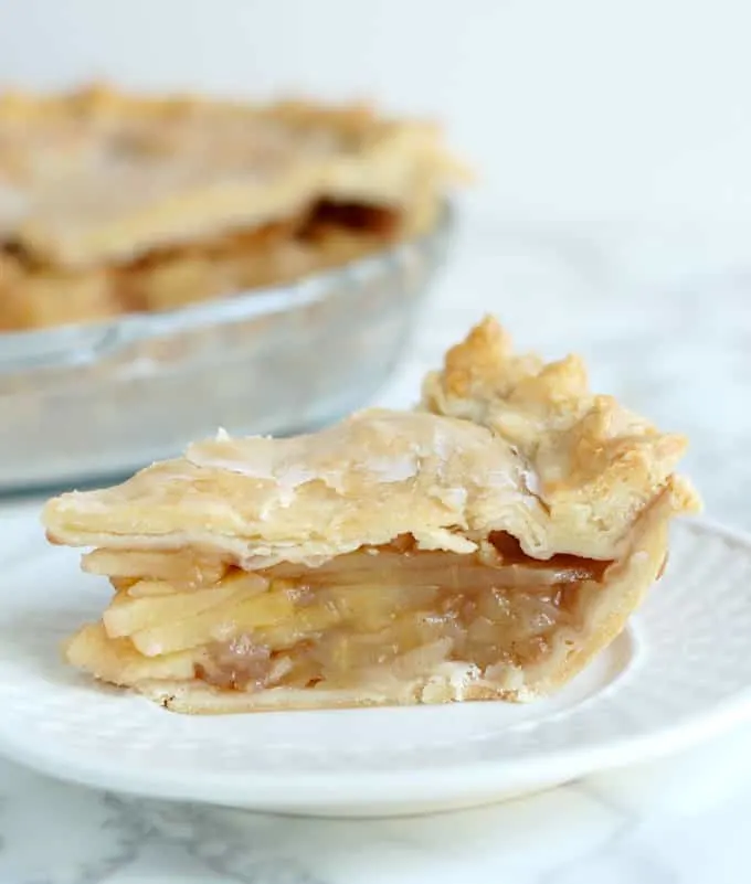 a slice of Apple Pie on a white plate.