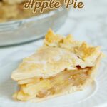 a slice of maple apple pie on a white plate.