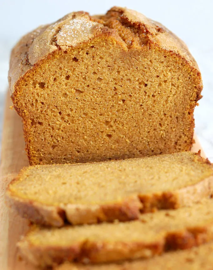 sliced honey pumpkin bread on a cutting board