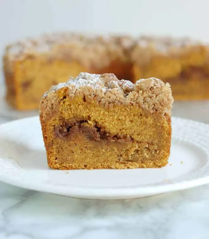 a slice pumpkin coffee cake on a plate