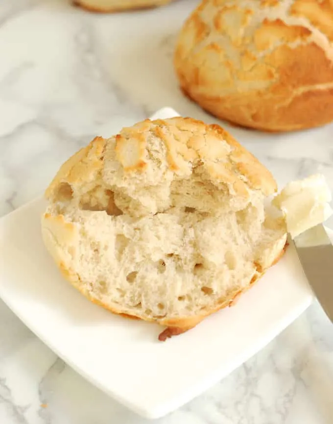 interior of a dutch tiger bread and a knife with butter