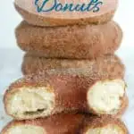a pinterest image showing a stack of sourdough donuts with text overlay