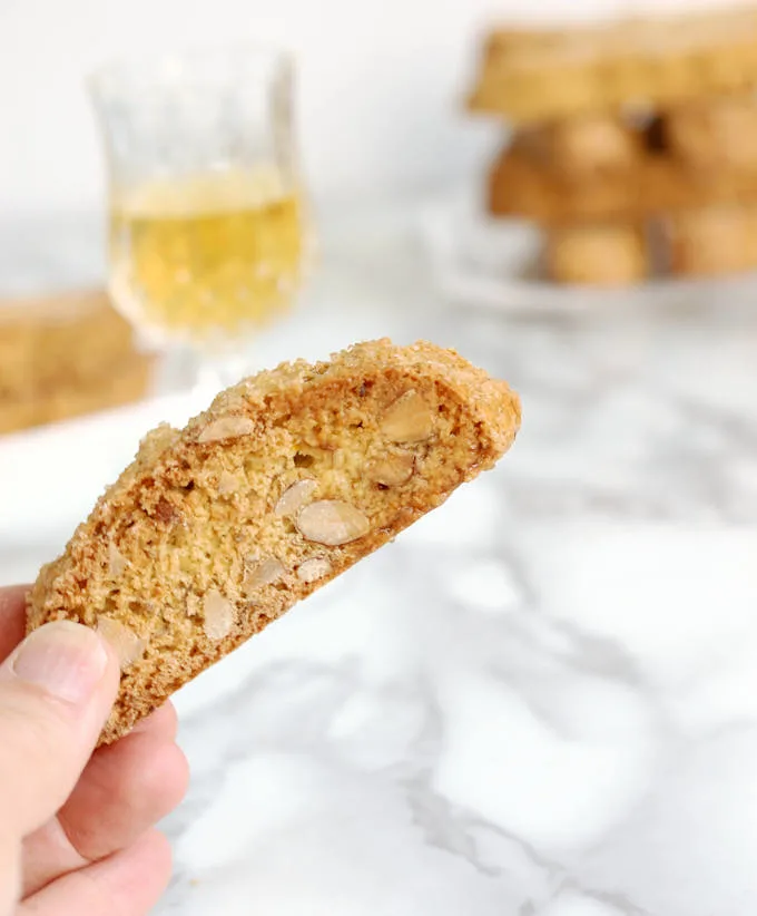 a hand holding anise & Orange Biscotti