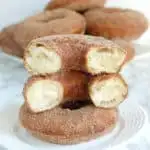 a plate of sourdough donuts with cinnamon sugar