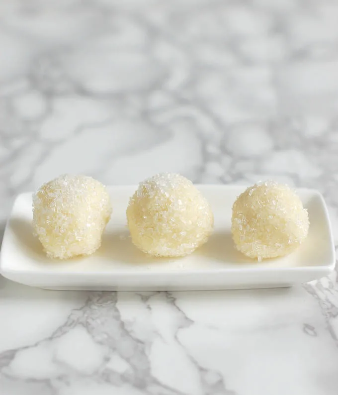 white chocolate ganache snowball truffles on a plate