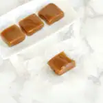 caramels on a white plate.