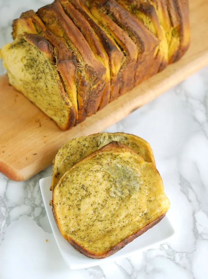 two slices of pumpkin pull apart bread on a plate