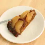 a slice of Pear Gingerbread upside down cake on a plate