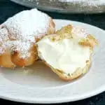 a plate with 2 cream puffs filled with Pastry Cream