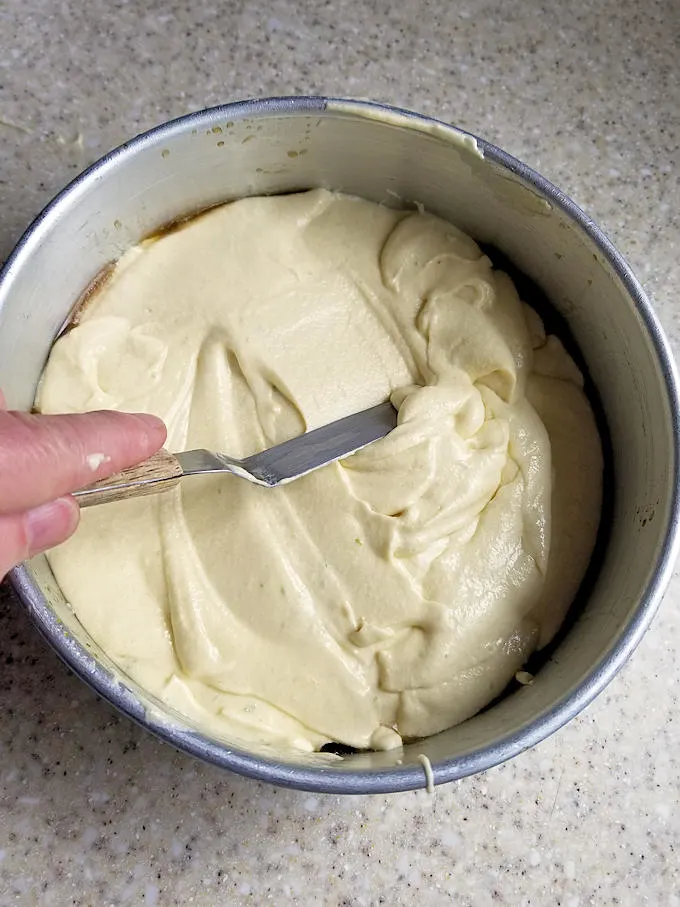 spreading cake batter in a pan