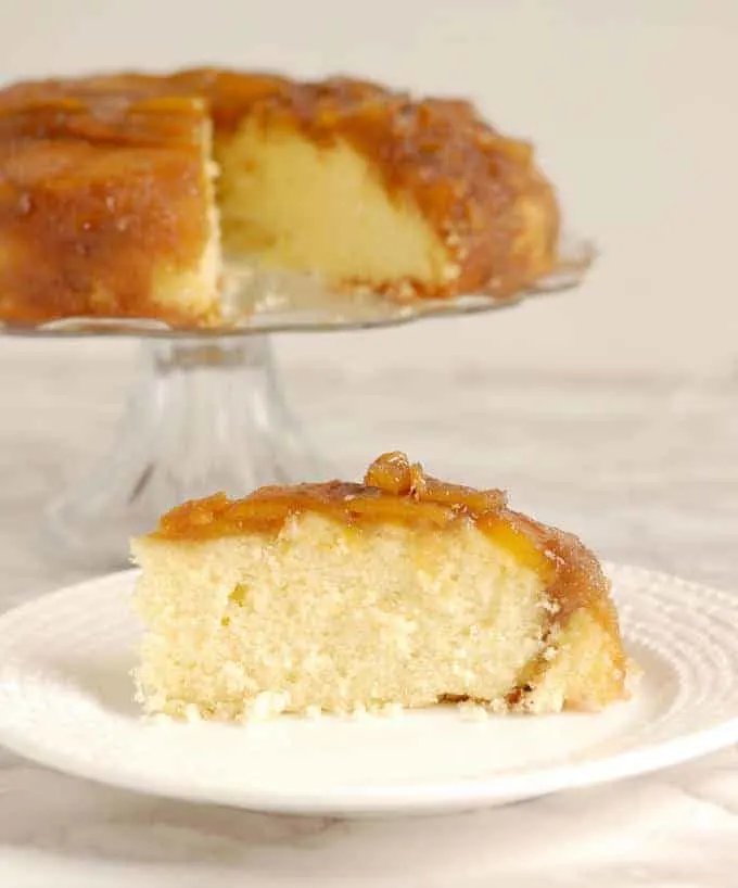 a slice of mango upside down cake on a plate