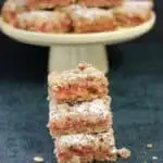 a stack of rhubarb crumble bars