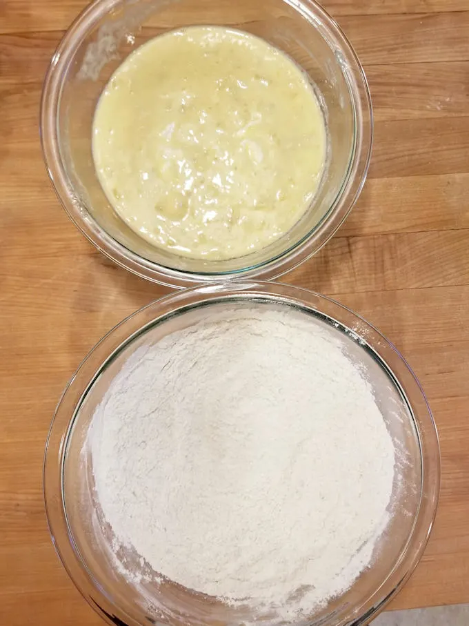 a bowl of wet ingredients and a bowl of dry ingredients for banana bread recipe
