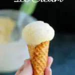 a hand holding an ice cream cone