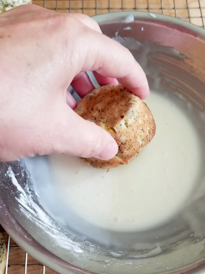 glazing a lemon poppy seed squash muffin