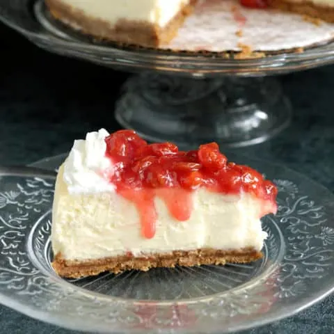 a slice of New York Cheesecake with sour cherry topping
