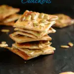 a pinterest image for pumpkin seed crackers with text overlay