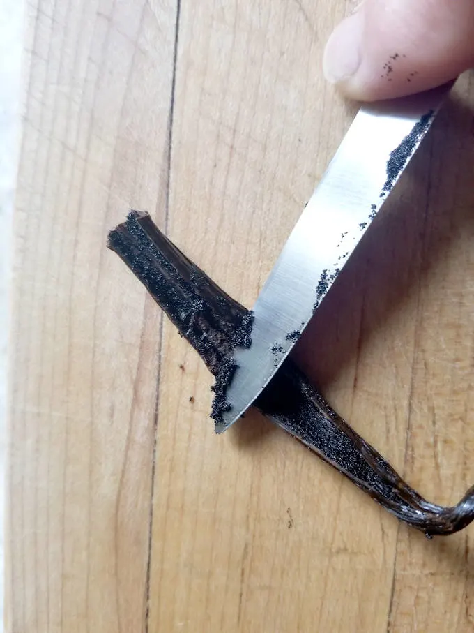 scraping a vanilla bean for the seeds