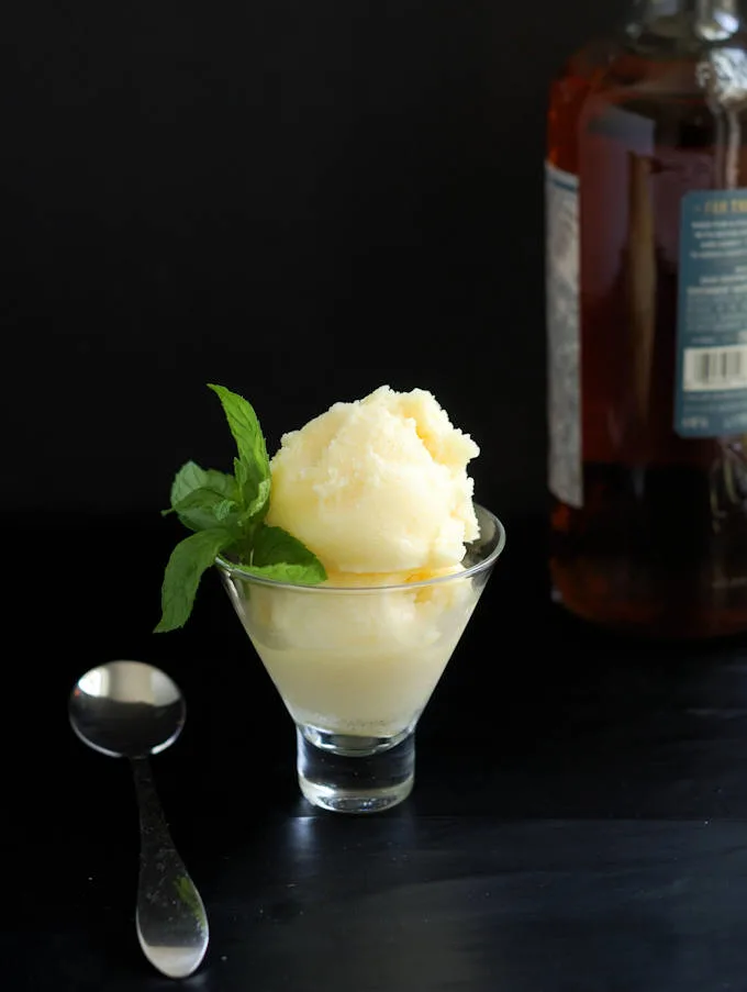 a glass filled with homemade pineapple rum sorbet